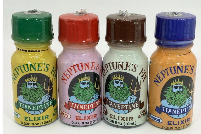 Four bottles of the tianeptine-containing product Neptune's Fix lined up side by side.