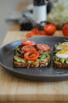 Adding salt to avocado toast