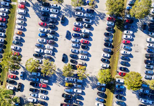 Aerial view of a busy parking lot in baking Australian sun