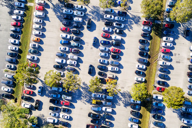 Aerial view of a busy parking lot in baking Australian sun