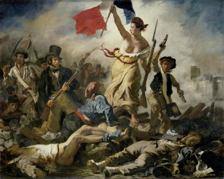 A woman of the people (personifying the concept of Liberty) amid the bodies of the fallen, holding aloft the tricolour flag.