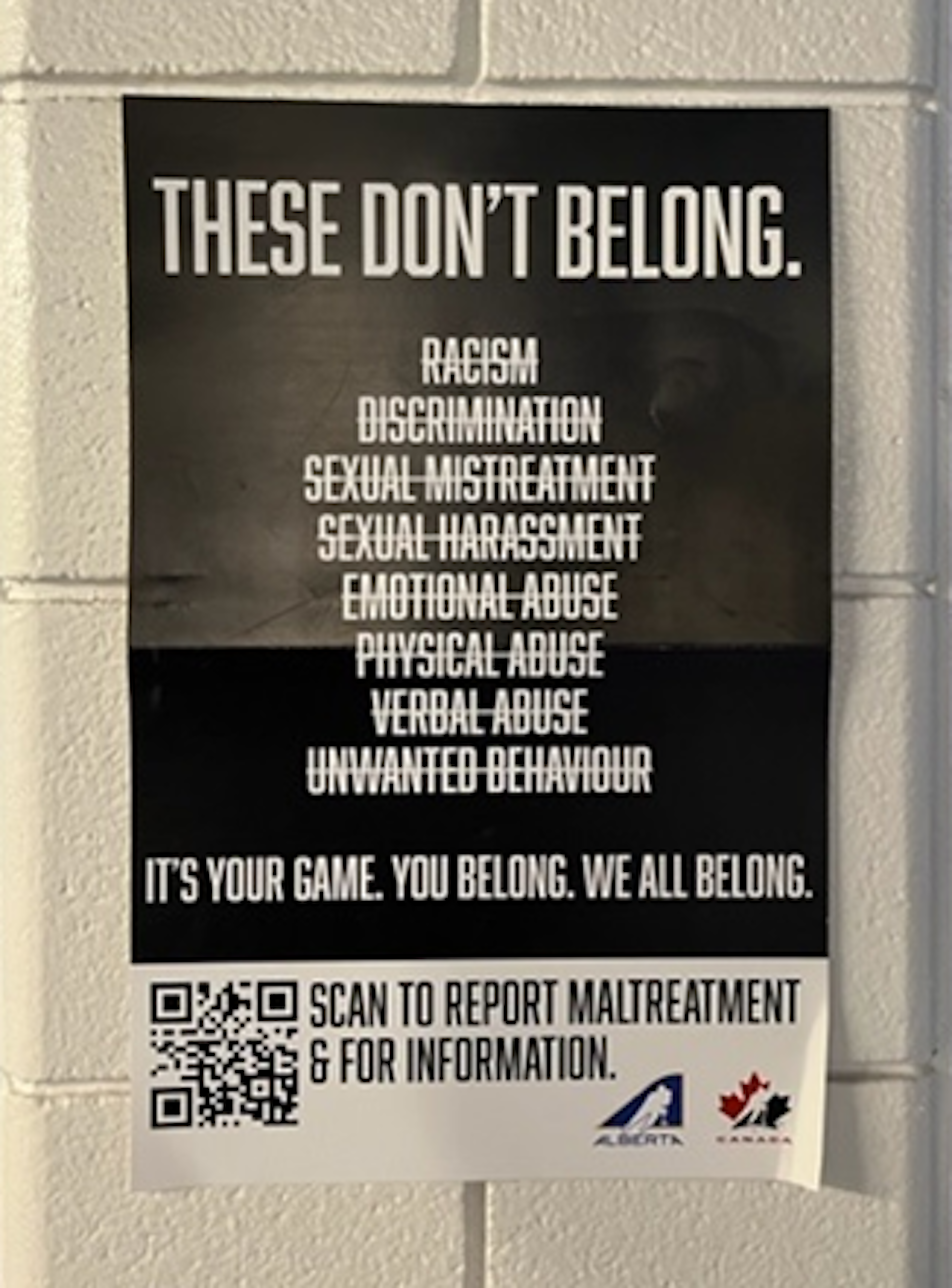 A poster that says 'These don't belong' with the following words crossed out: racism, discrimination, sexual mistreatment, sexual harassment, emotional abuse, physical abuse, verbal abuse, unwanted behaviour.'