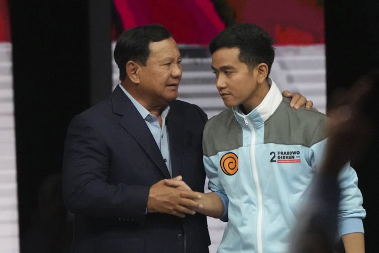 Political candidates shake hands in Jakarta, Indonesia.