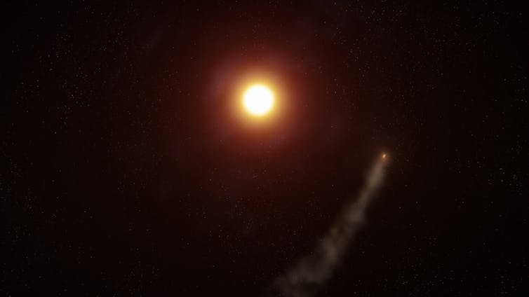 A planet with a tail-shaped cloud of gas around it, orbiting a sun.