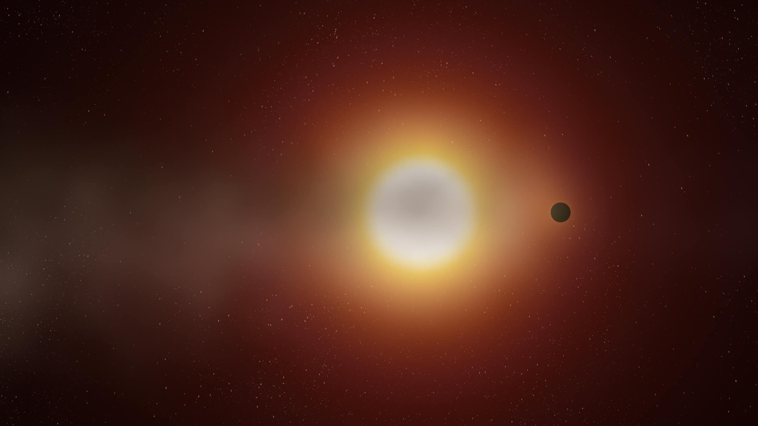 A small planet orbiting around a sun.
