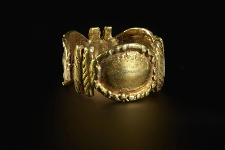A gold ring on a table