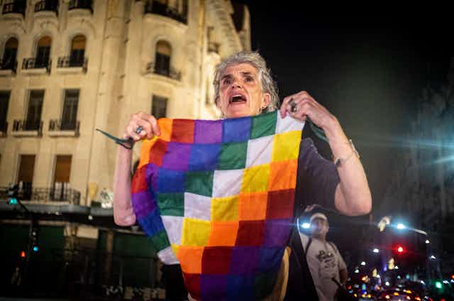 Woman with colourful flag