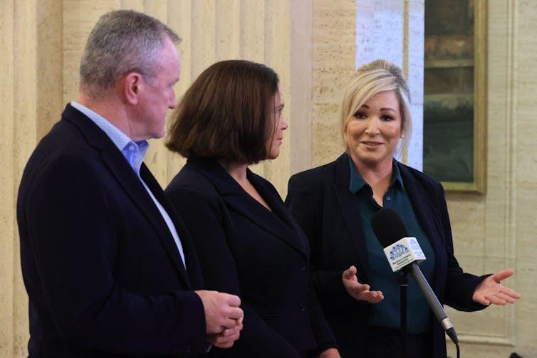 Sinn Fein representatives MLA Conor Murphy, president Mary Lou McDonald and vice-president Michelle O'Neill at a microphone during a press conference