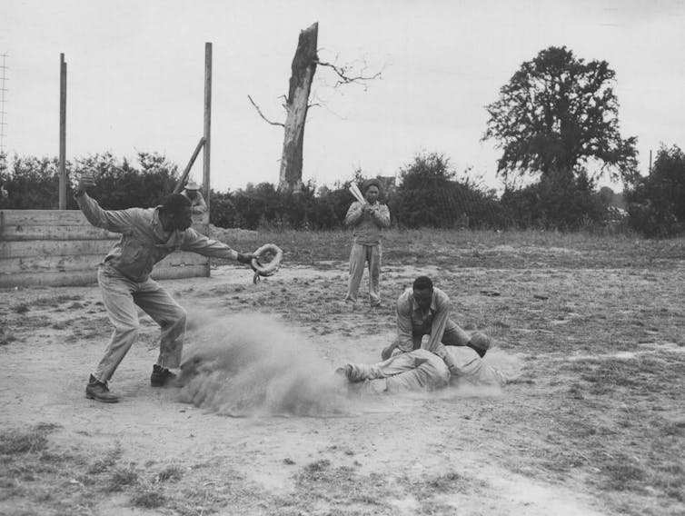 Men of the 923rd Engineer Aviation Regiment enjoy a game of baseball