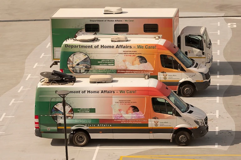 Three vehicles with Department of Home Affairs branding