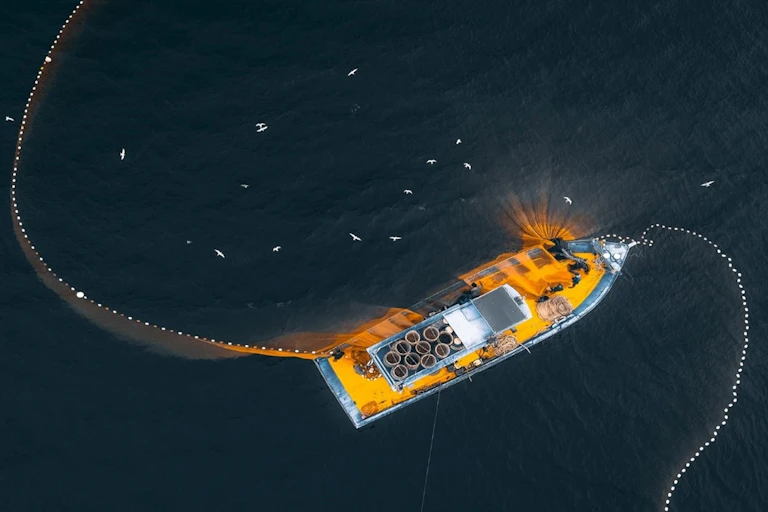 Drone view of fishing trawler on sea