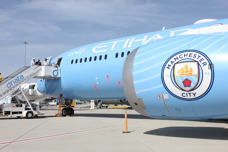 Sky blue plane with Manchester City logo