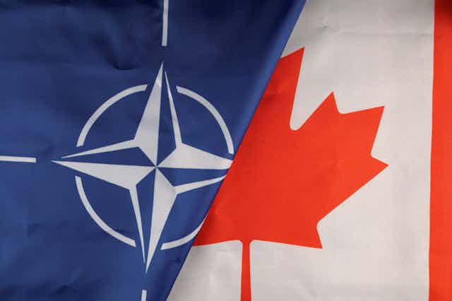 The NATO and Canadian flags seen next to each other.