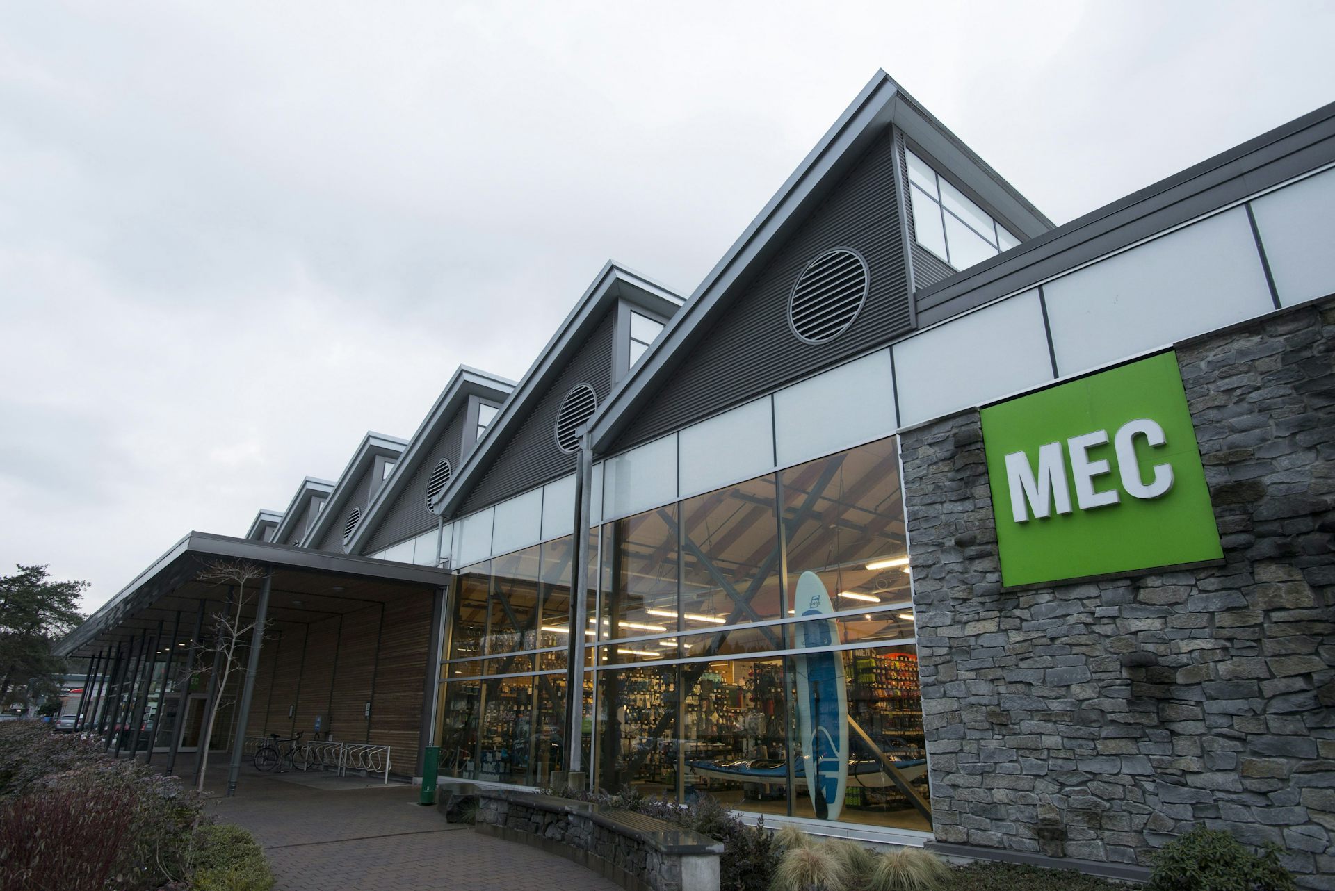 A building with a green sign that says MEC on it