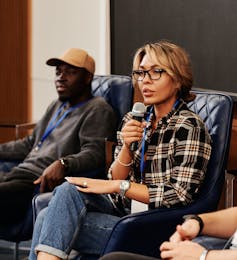 A person seen with a microphone.