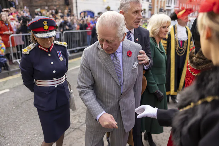 British king reacts after egg is thrown at him.