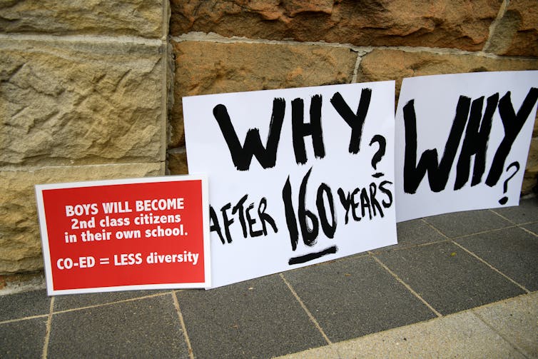 Placards from the Newington protests, saying 'Why after 160 years?'