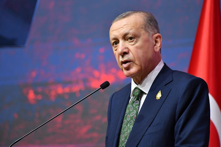 Turkish president, Recep Tayyip Erdoğan, speaking at a conference.