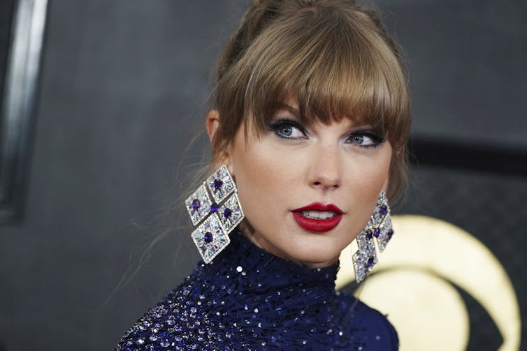 The head and shoulders of a blonde woman looking just past the camera