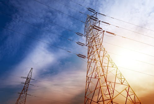 Wholesale power prices are falling fast – but consumers will have to wait for relief. Here’s why