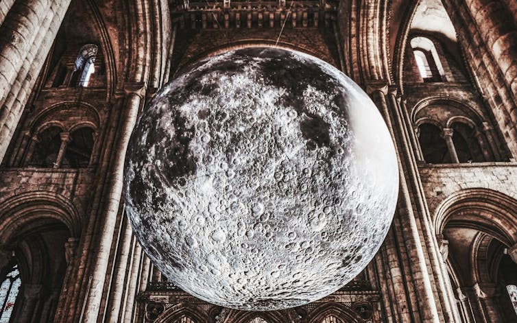A picture of a moon installed in a church.