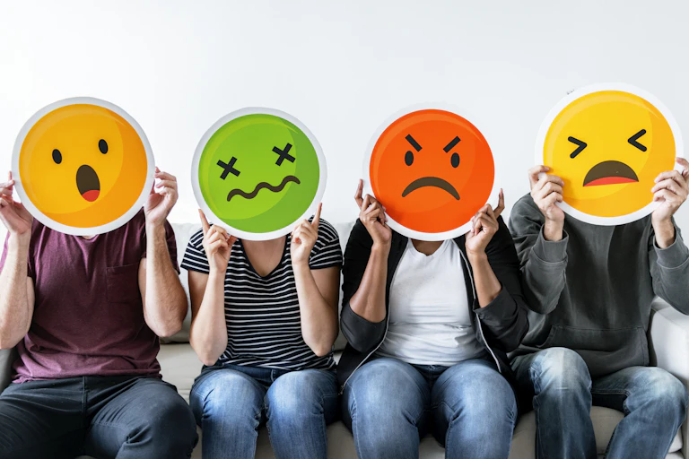 four people with negative3 emojis over their faces