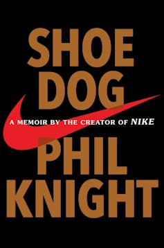 A black book cover with a red check mark on it titled 'Shoe Dog' by Phil Knight