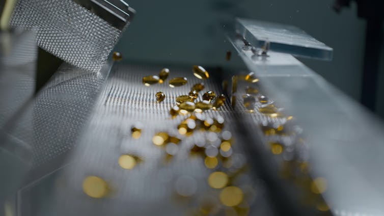 clear capsules being produced by machine