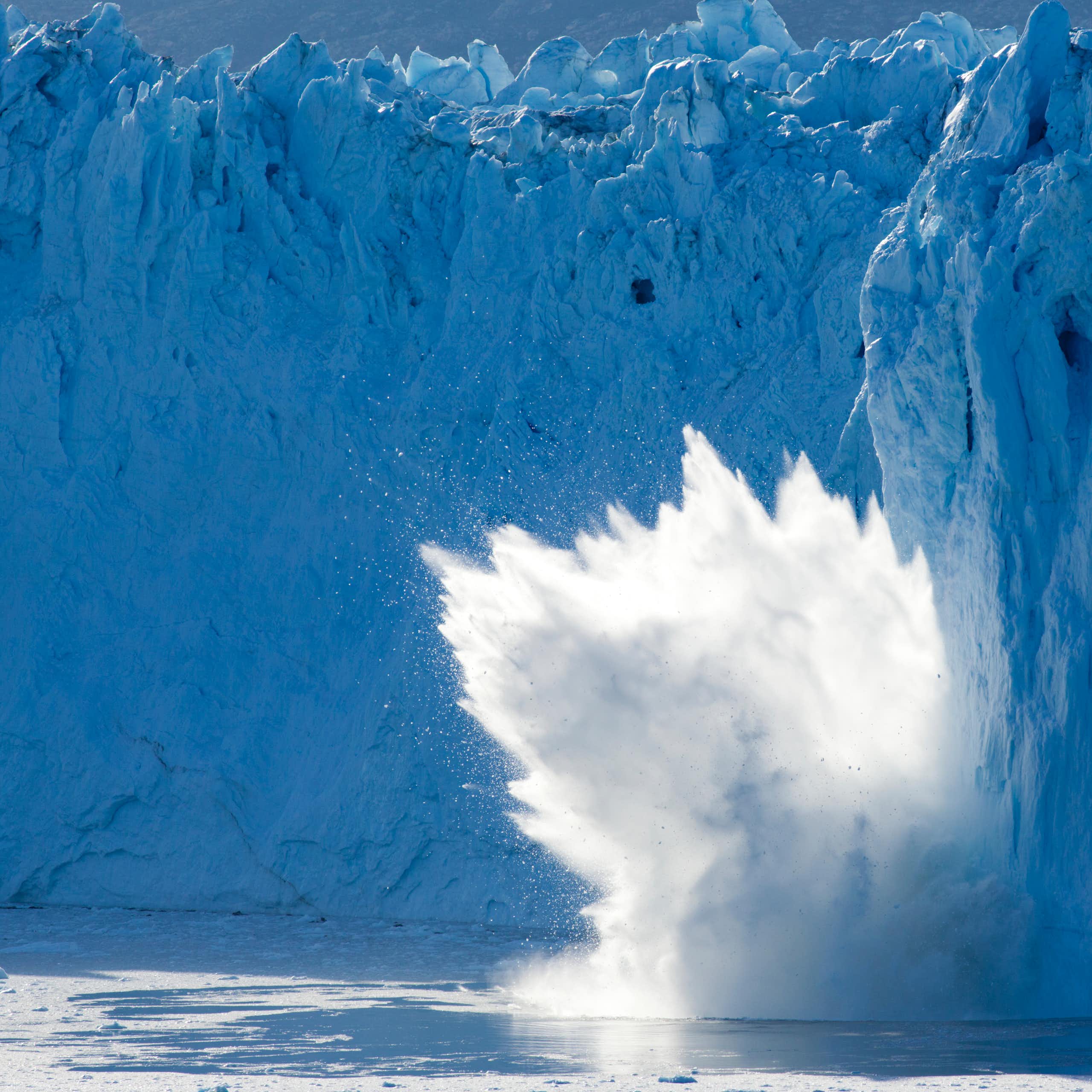 A glacier calving makes a huge splash.
