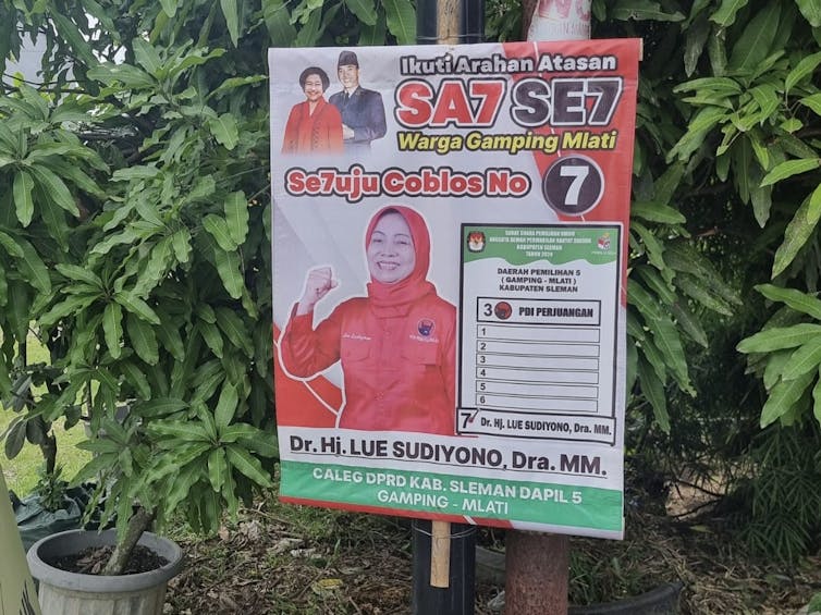 An Indonesia political poster featuring a woman in a red outfit