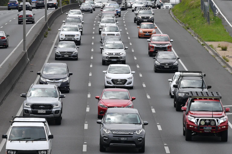 Freeway traffic in Brisbane with many large SUVs and utes
