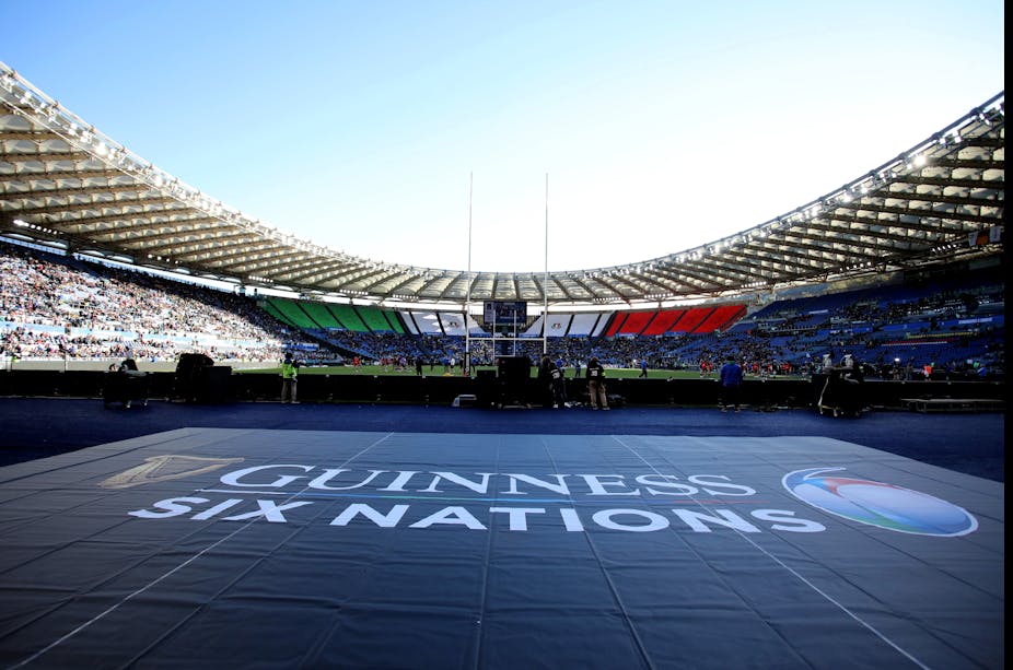 A wide shot at the Stadio Olimpico in Roma where the words 'Guinness Six Nations' is emblazoned on the field. 