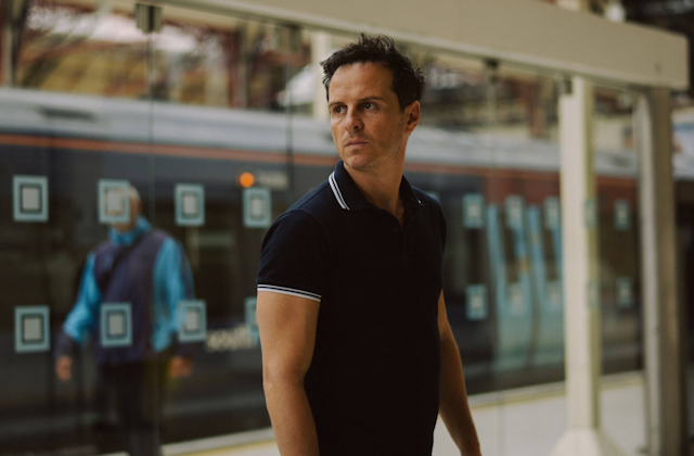 A dark-haired fortysomething man dressed in a blue polo shirt.