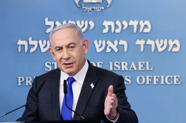 Israeli prime minister Benjamin Netanyahu gestures with his left hand at a press conference, February 2014