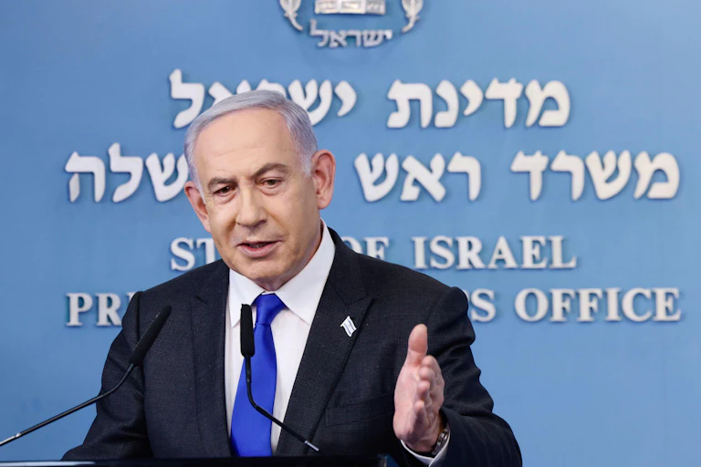 Israeli prime minister Benjamin Netanyahu gestures with his left hand at a press conference, February 2014