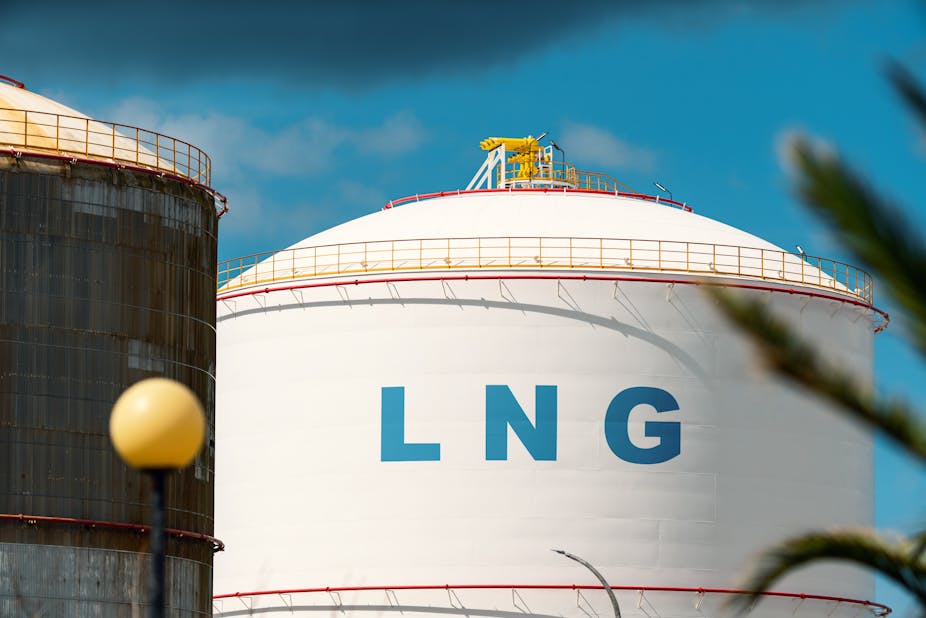 A white storage tank with 'LNG' in blue letters on it.