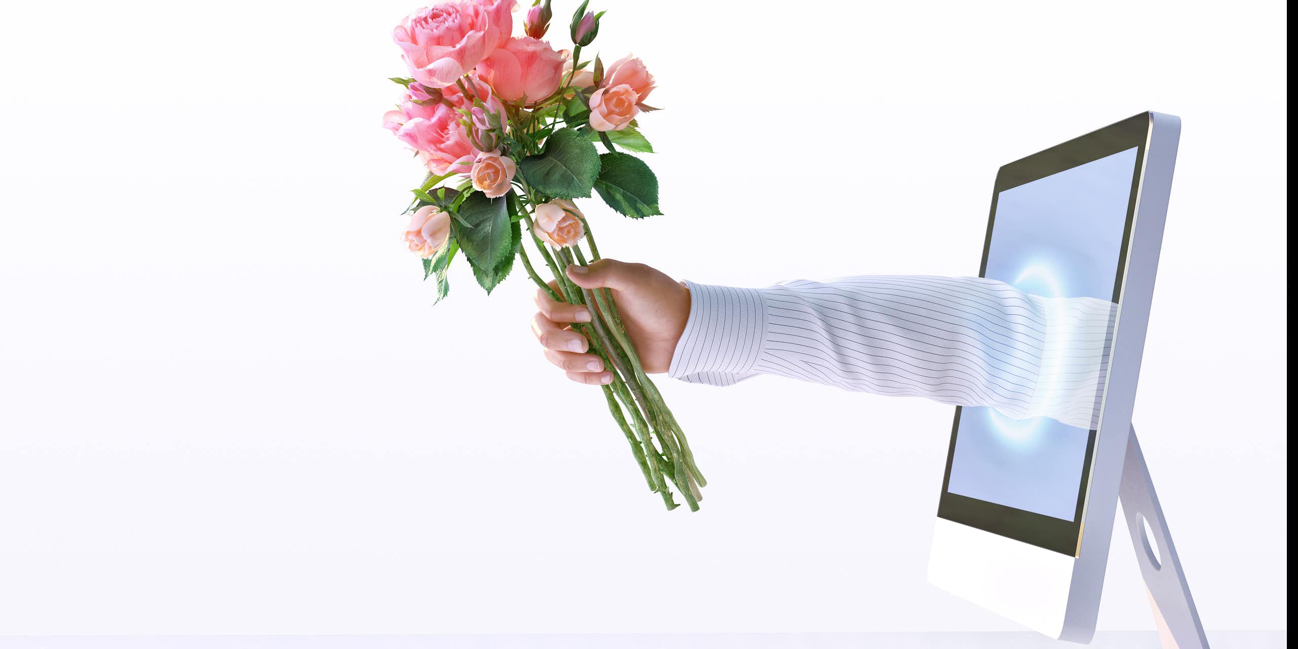 an arm reaching out from a computer screen, holding bouquet of roses