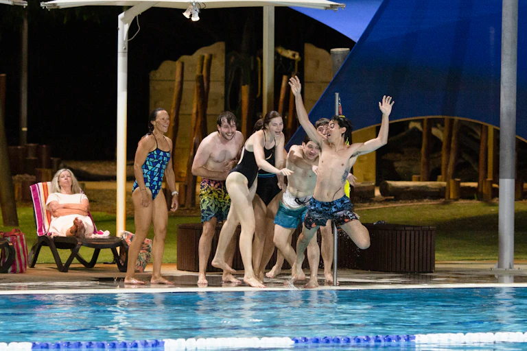 The cast on the edge of a pool