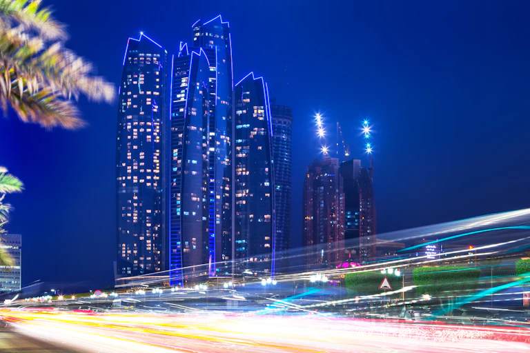 Abu Dhabi skyscrapers with traffic flashing by
