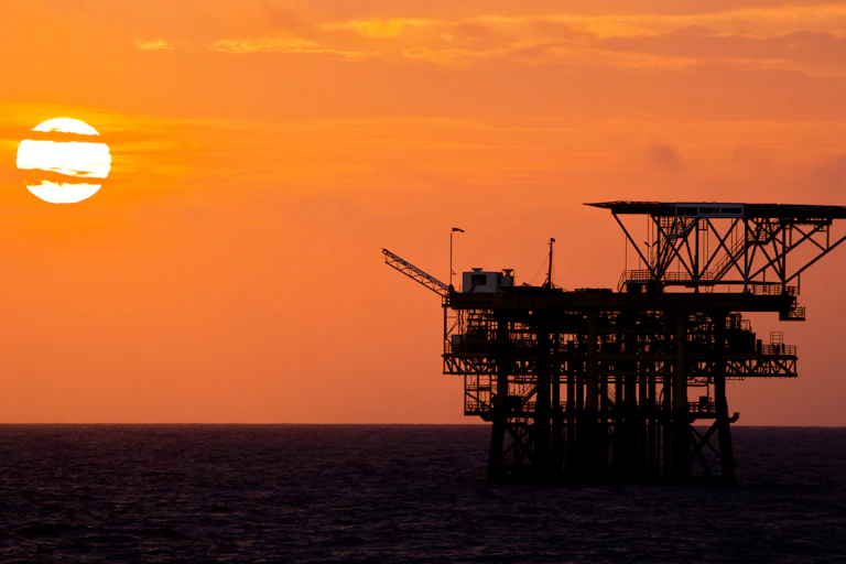 Oil rig at sunset