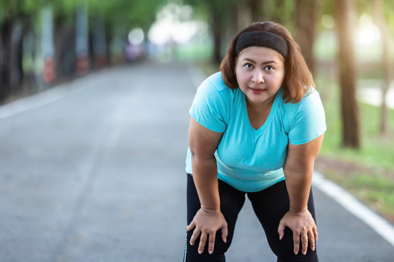 Woman tired after running in park