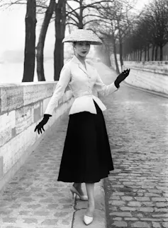 A model presenting Christian Dior's new look from 1947.