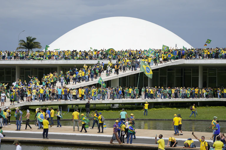 Hundreds of people dressed in green and yellow, the colours of the Brazilian flag, occupied the entrance to the National Congress.