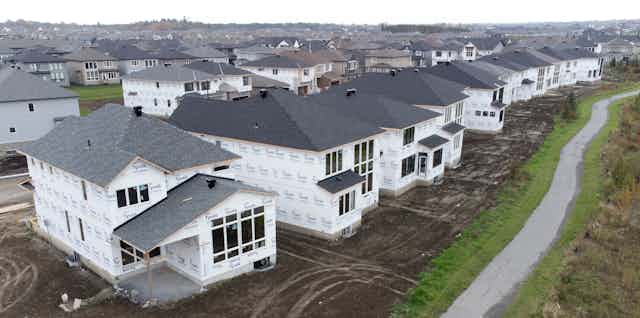 A row of similar homes under construction.
