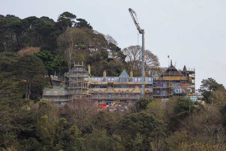 Large building under construction in woods