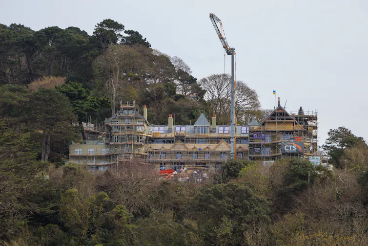 Large building under construction in woods