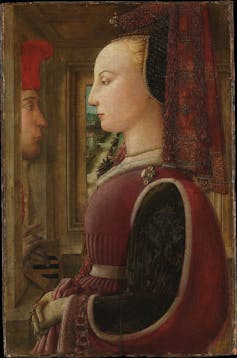 Portrait of a bald woman in profile.