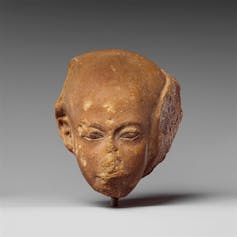 A statue of a bald-headed princess