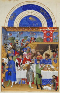 Pintura medieval de una banquete al que acuden muchas personas.