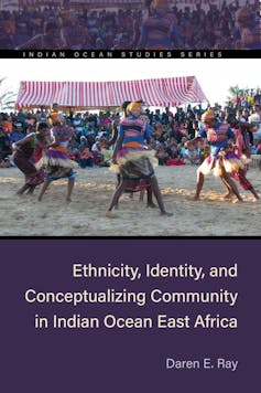 A book cover featuring a photo of a group of women performing a traditional dance.